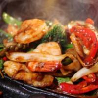 24. Mix Grill · Combination of tandoori chicken tikka, chicken kabob, and shrimp.
