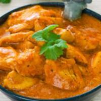 26. Chicken Curry · Chicken cooked in freshly ground spices and light gravy.