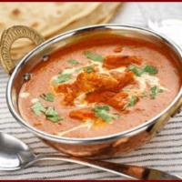 27. Chicken Tikka Masala · Tandoor Grilled boneless chicken cooked in mild tomato sauce with cream.
