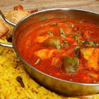 32. Chicken Madras · Southern Indian curry with boneless chicken in coconut, curry, coriander leaves, and mustard...