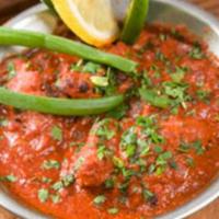 45. Goat Curry · Sauteed with rich tomato sauce, ginger, garlic, and spices.