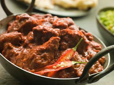 42. Kadai Lamb · Tender boneless pieces of lamb cooked with green peppers, ginger, garlic, and spice.