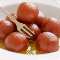 108. Gulab Jamun · Homemade soft cheese balls dipped in honey syrup served warm.