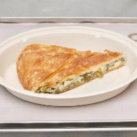Spanakopita · Traditional Greek spinach pie with fresh herbs, authentic olive oil and aged feta wrapped wi...