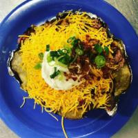Chopped Brisket Baked Potato · Stuffed with margarine, real sour cream, real cheddar cheese, bacon and green onions.