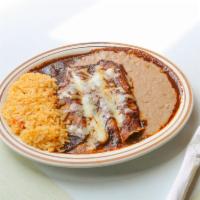 Enchiladas de Mole · 3 enchiladas. Sweet Mexican barbecue enchiladas topped with cheese. Served with rice and bea...
