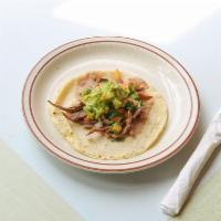 Taco de Cecina · Guacamole, beans, and pico de gallo.