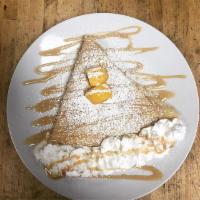 Mango Crepe · Topped with powdered sugar, whipped cream and syrup.