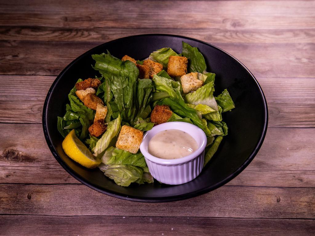 Hail Ceasar · Staying true to the tradition: crisp romaine, fresh parmesan, homemade croutons, and ceasar dressing make this a sure classic.