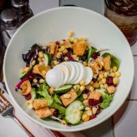 The Front Porch Salad · Mixed greens, Napa cabbage, corn, dried cranberries, cucumber, fried wonton, chick peas, toa...