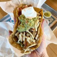Fajita Chicken Taco · choice of steak or chicken with grilled onions + bell peppers, jack cheese, sour cream, guac...