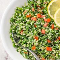 Tabbouleh Salad · Fresh chopped parsley pre mixed with tomatoes, onions, and bulgur wheat, all toasted with li...