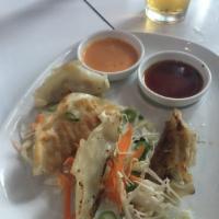 Gyoza · Dumplings filled with ground chicken and vegetables.