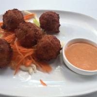 Conch Fritters · Caribbean style conch served with spicy mayo.