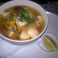 Tom Yum Soup · Spicy lemon grass soup with mushrooms, cilantro and choice of protein.