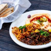 36. Hummus with Shawarma · Hummus with your choice of beef and lamb, chicken or mixed shawarma with pita bread.