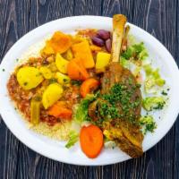 38. Couscous Platter · Couscous served with chicken, beef and lamb or mixed shawarma.