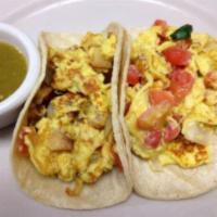 Breakfast Tacos on Tortilla · Corn or flour tortilla. Traditional Texas tacos with a choice of: egg and potatoes, egg and ...