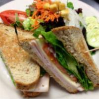 Turkey and Jack Sandwich · Smoked turkey breast, jack cheese, romaine heart, sliced tomatoes, red onions, chipotle mayo...