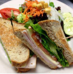 Turkey and Jack Sandwich · Smoked turkey breast, jack cheese, romaine heart, sliced tomatoes, red onions, chipotle mayo on our whole wheat toasted bread.