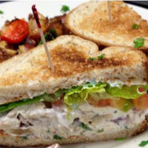 Sonoma Chicken Salad Sandwich · Our homemade sonoma chicken salad on romaine heart, tomatoes, shredded carrots, avocado, light mayo and mustard on toasted whole wheat bread.