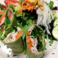 Turkey and Avocado Wrap · Smoked turkey breast rolled with shredded carrots, avocado, our own salsa, organic baby gree...