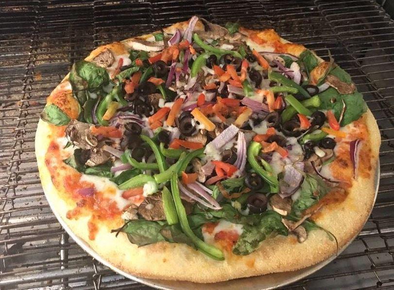 Amigos Veggie Garden Pizza · Choice of any sauce, mushroom, red onion, spinach, green onion, bell pepper and black olives. Vegetarian.