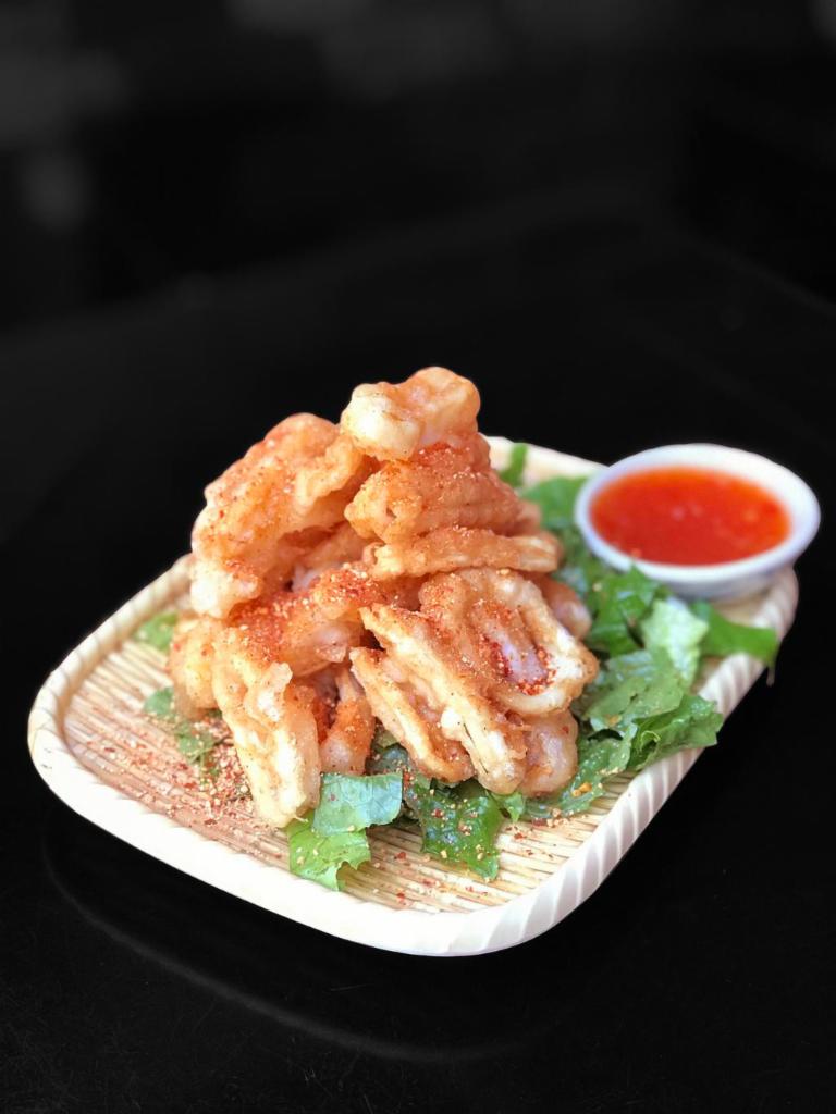 A2. Fried Calamari · Crispy fried calamari topped with Thai spicy seasoning served with spicy sweet chili sauce.