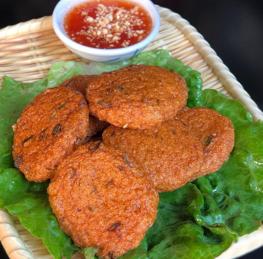 A7. Tod Mun · Fish cake. Crispy fish cake served with sweet and chili sauce topped with crushed peanut.