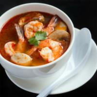 SP1. Tom Yum Soup · Thai hot and sour soup with shrimp pastes, lemongrass, lime leaves, lime juice, chili paste,...