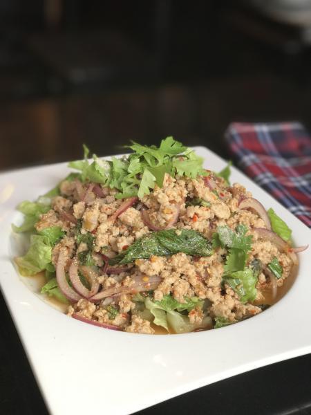 S5. Larb Gai · Thai minced chicken salad mixed with red onion, mint leaves  and roasted rice with special lime juice dressing topped with cilantro. Gluten-free.
