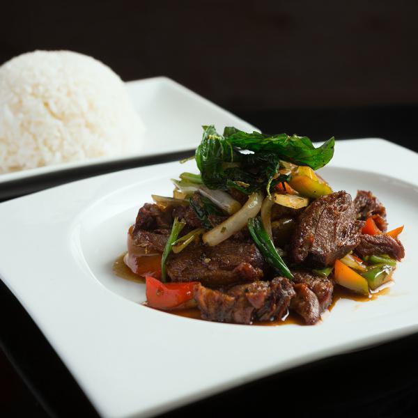 F7. Duck Krapraw · Crispy duck sauteed with onions, long hot chili, basil leaves, scallion and chili shrimp paste and basil sauce served with jasmine white rice. Gluten-free.