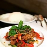 F11. Chic Krapraw · Chic a chicken sauteed with onions, long hot chili, basil leaves, scallion and basil sauce s...