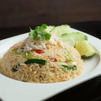 R1. Crab Fried Rice · Crab meat, onion, scallion, cilantro and egg served with homemade spicy seafood dressing on ...