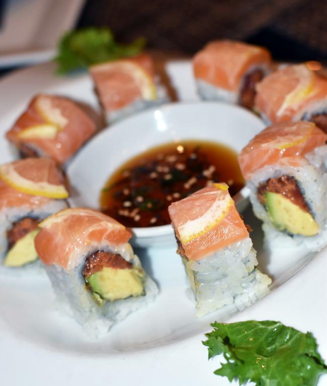 Yakuza Roll · Spicy tuna, avocado with salmon and lemon on top.