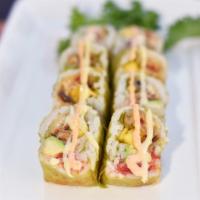 Green Monster Roll · Crunchy spicy tuna, mango, avocado and tempura eel wrapped in green soy paper and drizzled w...