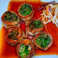 Beef Negimaki · Scallion wrapped in thinly sliced beef and served with teriyaki sauce.