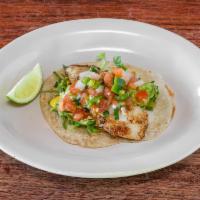 Fish Taco · Wood Grilled White Fish, Guacamole, Pico de Gallo & Aji Aioli w/ Lettuce