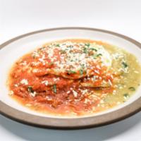 HUEVOS RANCHEROS · Salsa Smothered Oaxaca Cheese Quesadillas, Beans, Two Eggs Any Style, Cilantro & Cotija Chee...