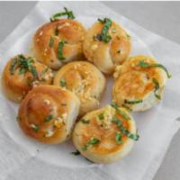 Garlic Knots (3) · A classic snack, our garlic knots are pizza dough tied in a knot, baked to perfection, toppe...