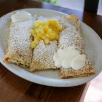 Sour Cream and Fresh Pineapple Crepes · Delicate & thin homemade crepes filled with sour cream filling and lightly sprinkled with po...