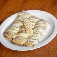 Sour Cream and Fresh Banana Crepes · Delicate & thin homemade crepes filled with sour cream filling and lightly sprinkled with po...