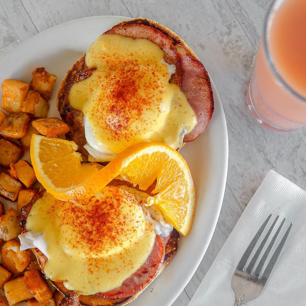Traditional Eggs Benedict · Canadian bacon on top of our homemade English muffin covered with hollandaise sauce and comes with a side of steamed rice, seasoned home-fried potatoes or 3 fluffy buttermilk pancakes.