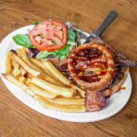 Paniolo BBQ Burger · !00% local beef patty, topped with cheese, bacon, onion rings, lettuce, and tomato. With our...