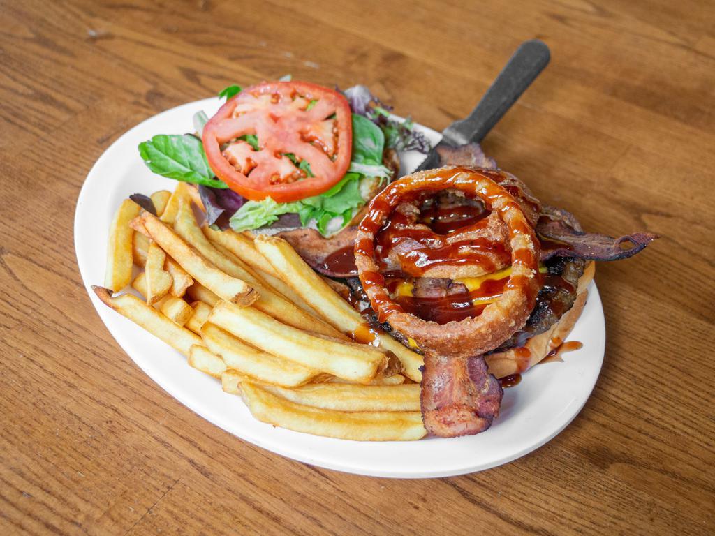 Paniolo BBQ Burger · !00% local beef patty, topped with cheese, bacon, onion rings, lettuce, and tomato. With our guava BBQ sauce. Served with fries or upgrade to our beer batter onion rings
