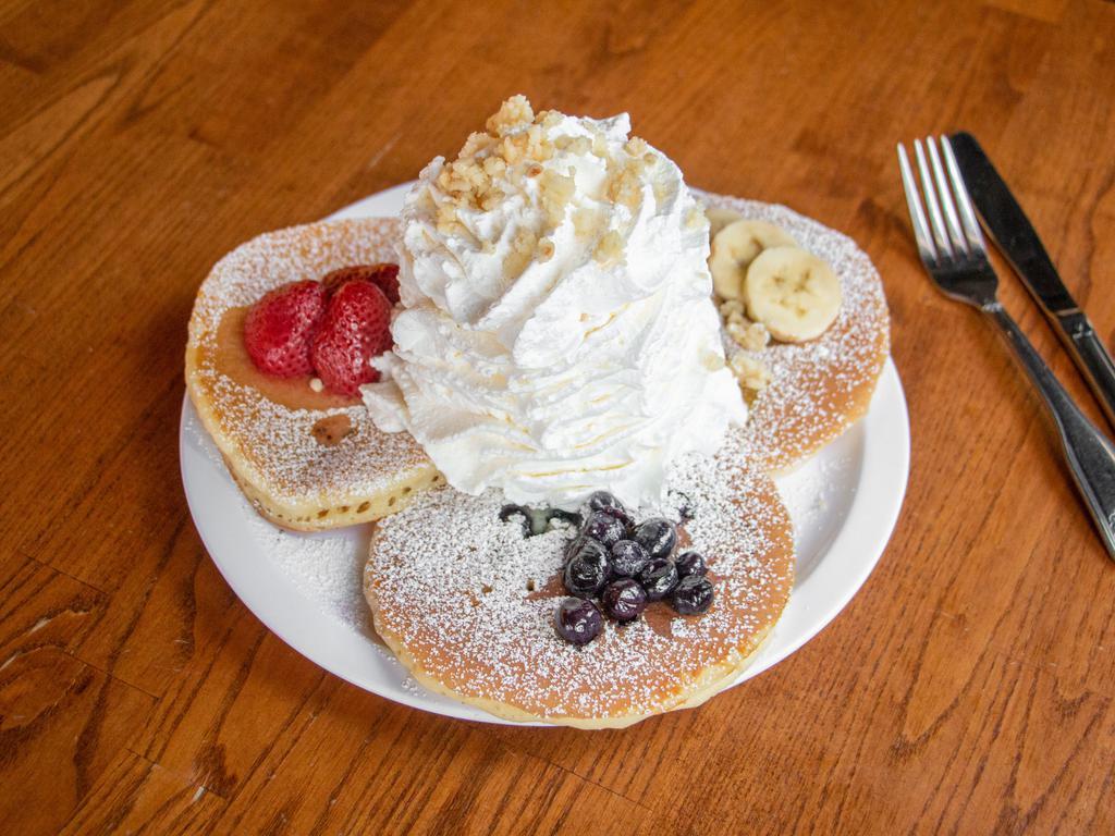 Whipped Cream Pancake Sampler · Strawberry, blueberry, and banana pancakes (3 pieces).