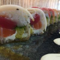Fancy rainbow · Nori, cream cheese,tuna,salmon, white fish, avocado topped with white fish, salmon and tuna
