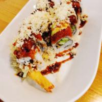 Tiger Roll · In- Shrimp tempura, cucumber
Out- Spicy tuna, avocado
Sauce- Eel sauce 