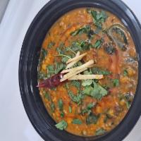 Yellow Daal  · Yellow lentils cooked with onions, tomatoes, and spices.
