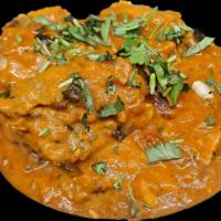Chicken Vindaloo  · Chicken cooked with potatoes and a special spicy sauce.